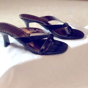Dressy or casual low heel dark brown sandals.
